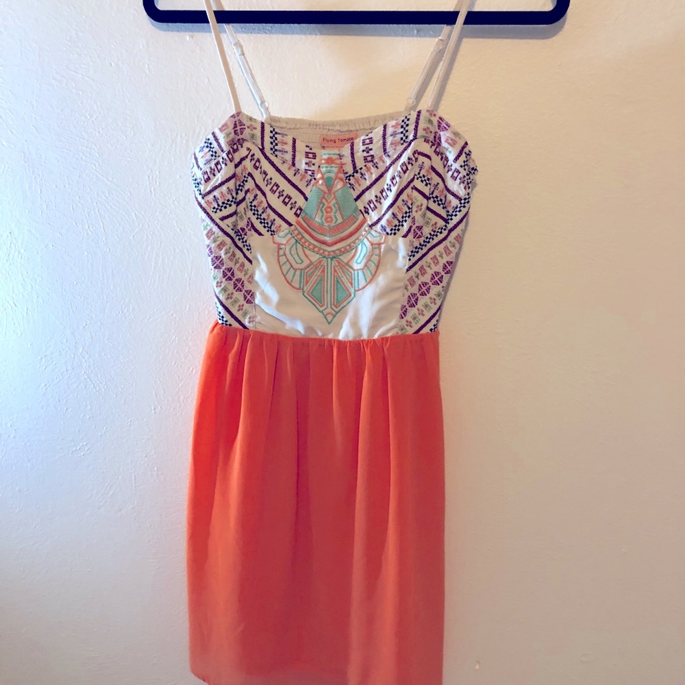 Orange sundress with embroidered bodice.